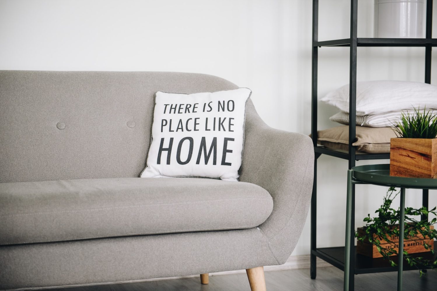 Photo by Anastasiia Chepinska white throw pillow on gray sofa